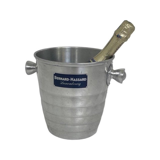 Champagne cooler or ice bucket made for Bernard Massard. Blank metal with their logo on the front side. Handles reinforced...