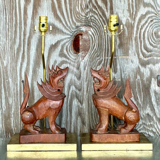 Add a touch of exotic elegance to your space with these stunning hand-carved wood lion lamps. Exuding boho-chic charm,...
