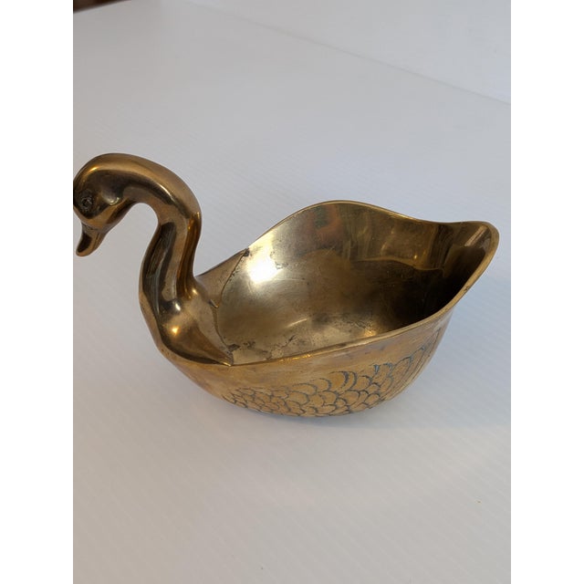 A wonderful 1960s solid brass Swan with deeply etched wing detail. It's hollow body lends itself to more than just decor....