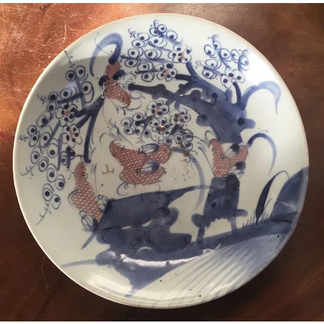 Antique early 19th century Chinese porcelain low bowl or charger decorated with a landscape scene in blue & white with red...