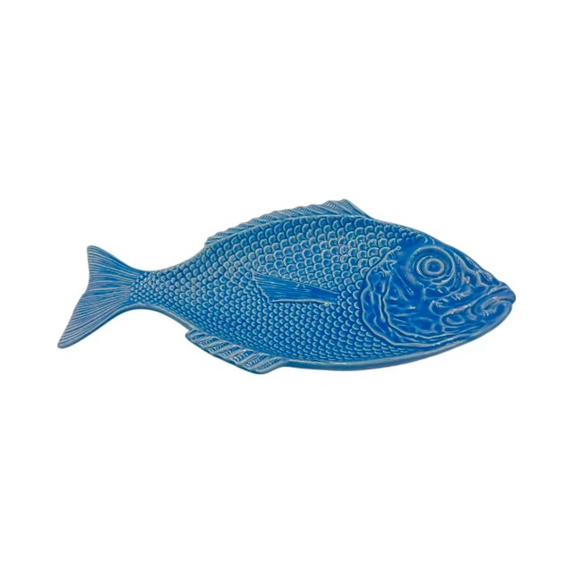Details: -Charming blue ceramic platter in the shape of a fish is perfect for dinner al fresco! -Made in Portugal -Approx....