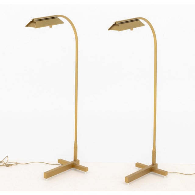 Pair of Casella Lighting Brushed Brass Adjustable Floor Lamps, labels to undersides. 43" H x 18" W x 10" D. Provenance:...