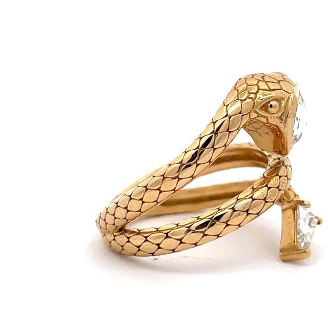 An authentic and sculptural high-jewelry serpent ring masterfully crafted in solid 18k yellow gold. Designed as an...