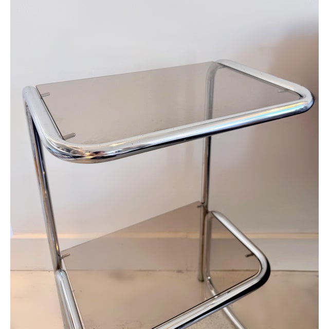A striking mid-century modern side table and shelving unit designed by Terence Conran for Habitat during the 1970s. The...