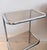 A striking mid-century modern side table and shelving unit designed by Terence Conran for Habitat during the 1970s. The...