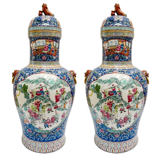 This striking pair of monumental 21-inch porcelain palace jars offers a commanding presence for a grand entryway, mantle,...