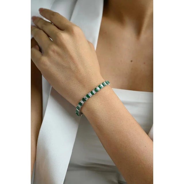 This is part of Chairish’s Fine Jewelry assortment. This Natural Emerald Tennis Bracelet in 18K gold with Diamond...