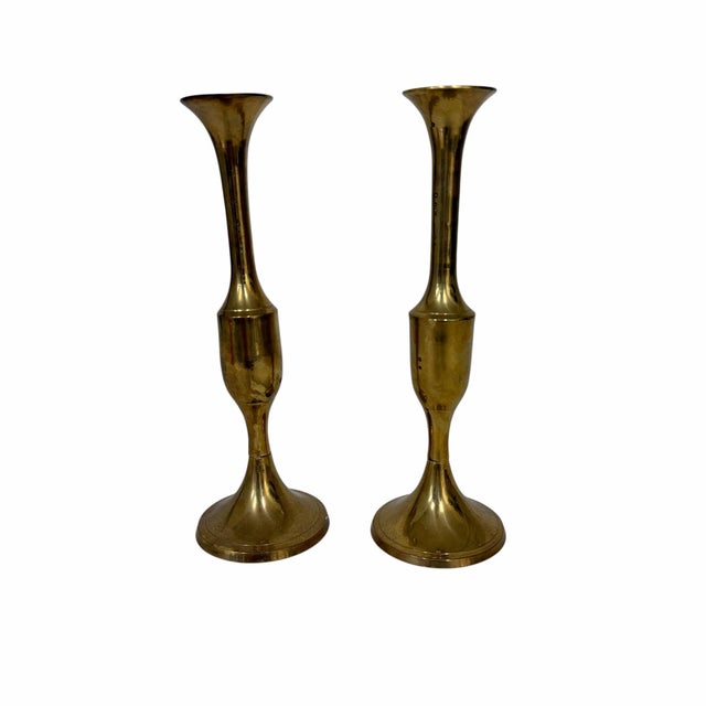Offering a pair of vintage brass candlestick holders. Each measures 2.5” diameter x 7” h. Holds small diameter taper...