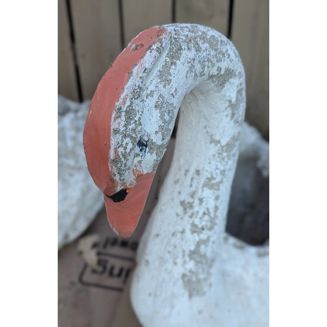 Antique Cement Large Swans for outdoor use. They have beautiful wing details with a lovely swan curved neck. The show wear...