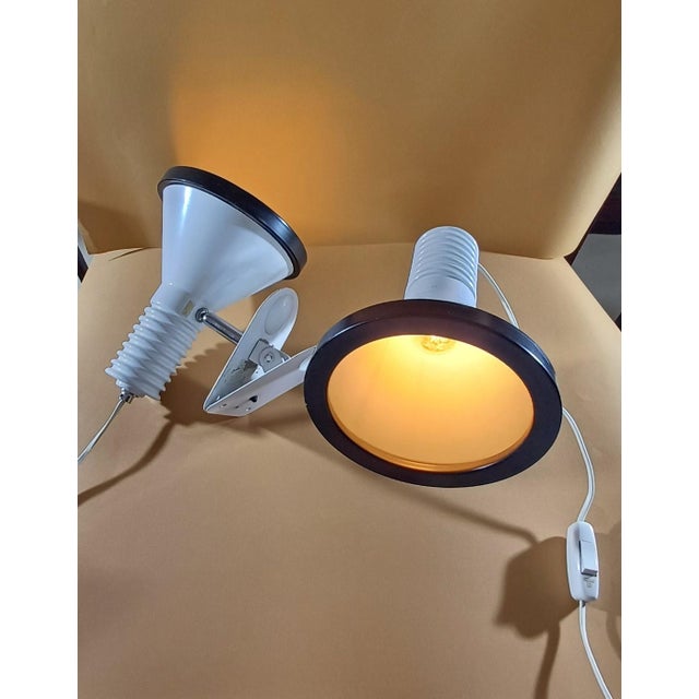 Pair of white lacquered aluminum clamp spotlights with black edge designed by Miguel Milá for the Tramo brand. The focus...