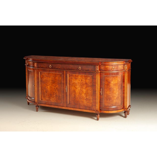 Handcrafted in Italy, this sideboard is made from select walnut and burl veneers with a book-matched burl top and fine...