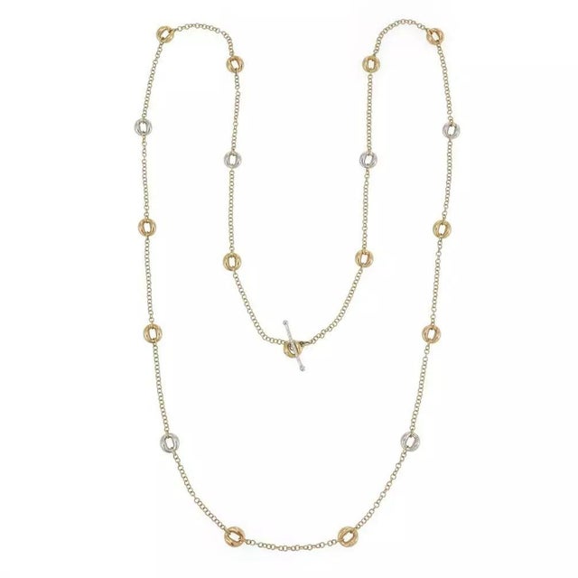 This long elegant authentic chain is by Roberto Coin, it is crafted from 18k yellow and white gold featuring a textured...