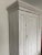 Stunning whitewashed solid pine armoire with white porcelain knob. Featuring simple lines and understated elegance, this...