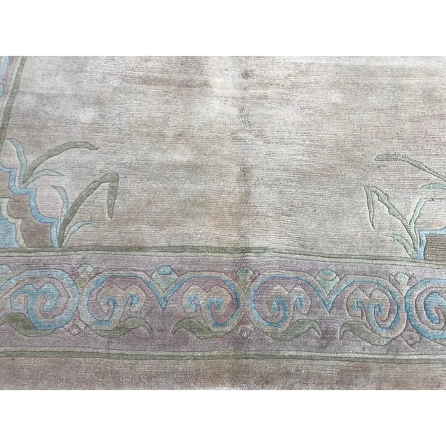 Beautiful light colors Tibetan Nepal rug, circa 1980 with a simple design and beautiful yellow field, blue and pink,...