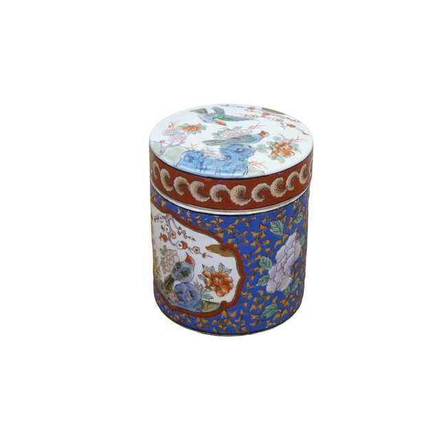 A vibrant vintage Chinese export porcelain lidded storage jar (styled as a ginger jar or tea caddy) meticulously decorated...