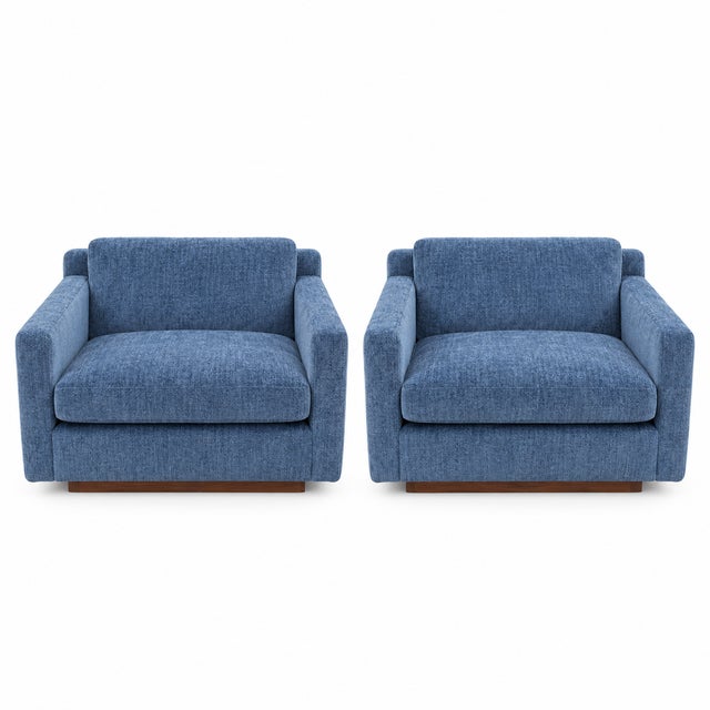 Pair of Mid-Century Lounge Chairs in Blue Chenille with Walnut Bases A handsome pair of mid-century lounge chairs, freshly...