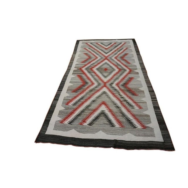 Antique Navajo American Flat Weave Rug medallion, Circa Date: 1920s. This exceptional example of early 20th-century Native...