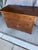 This item is an antique wooden chest of drawers, featuring Federalist and similar traditional styling with decorative...