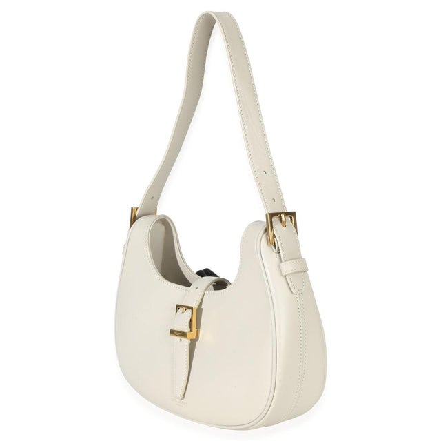 Item #: 153179 Interior Material: Suede MSRP: 3,030 Features Interior: One zip pocket Dimensions: 9.25 x 6.5 x 2.25 in...