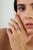 This halo engagement ring showcases a 0.74 carat pear-cut emerald set in 14k white gold. The emerald measuring 7.2 x 5.9...