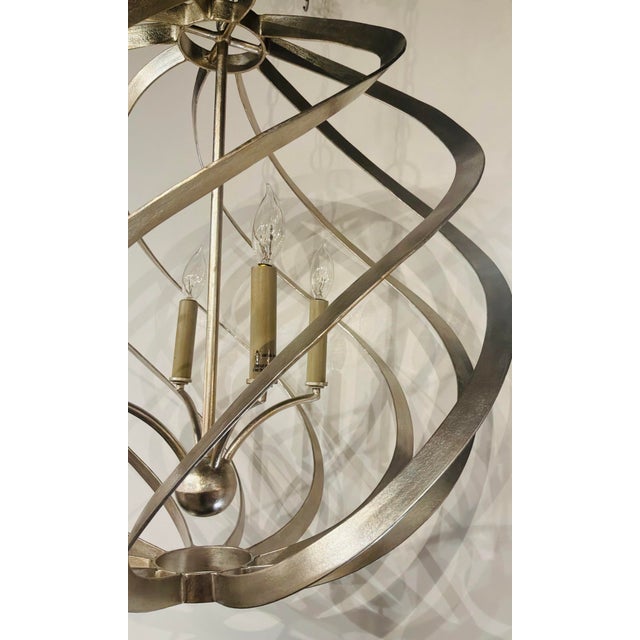 Original retail $1640, stylish Currey & Company Silver Orb Roussel Chandelier, showroom floor sample