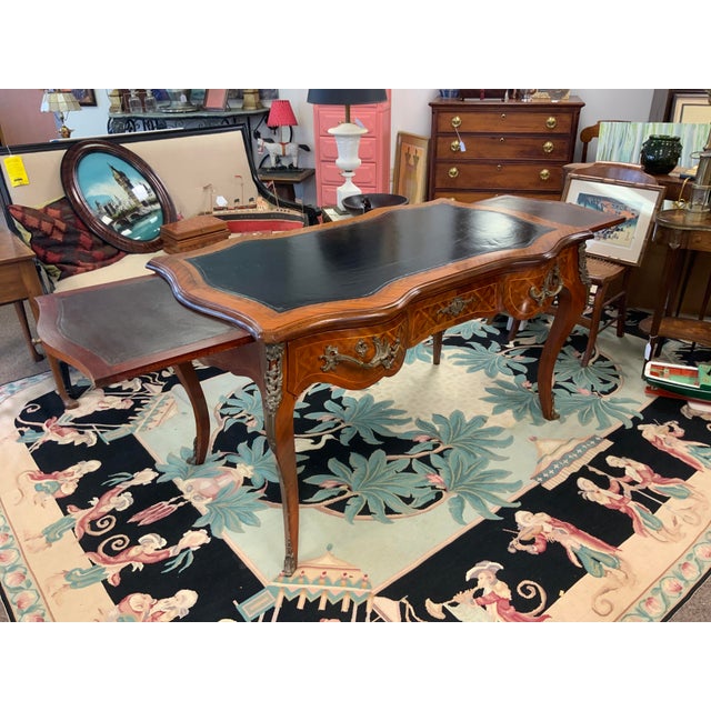 20th century reproduction of a Louis XV style writing desk. Beautiful geometric parqutry inlay, serpentine shape, leather...