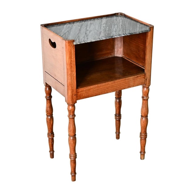 A charming 19th century French Louis Philippe style oak and marble bedside table, though the dainty scale could be used as...