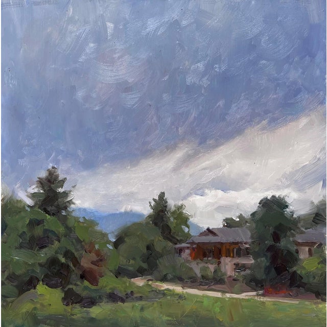 In "Chance of Showers," a serene landscape unfolds, capturing a moment where lush greenery meets a dramatic sky filled...