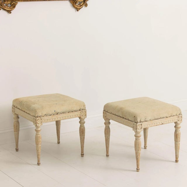 A charming pair of Swedish benches from the early Gustavian period in original paint, circa 1780. These stools display...