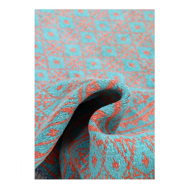 Introducing our stunning sumak cotton rug, a true masterpiece of traditional weaving techniques and bold design. Using the...