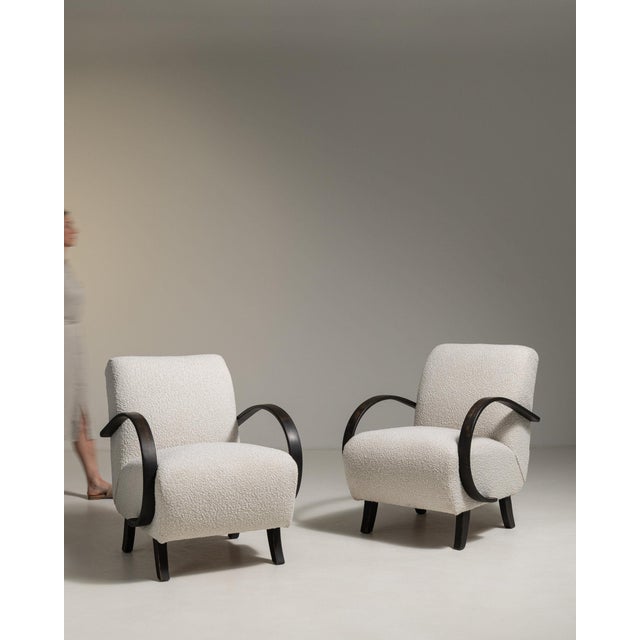 A dining chair whose cream boucle upholstery gives it real character at first glance. Originating in France during 1950s,...