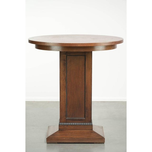 This Dutch oak side table features beautiful details and is crafted in a luxurious Amsterdam School style. Side tables are...