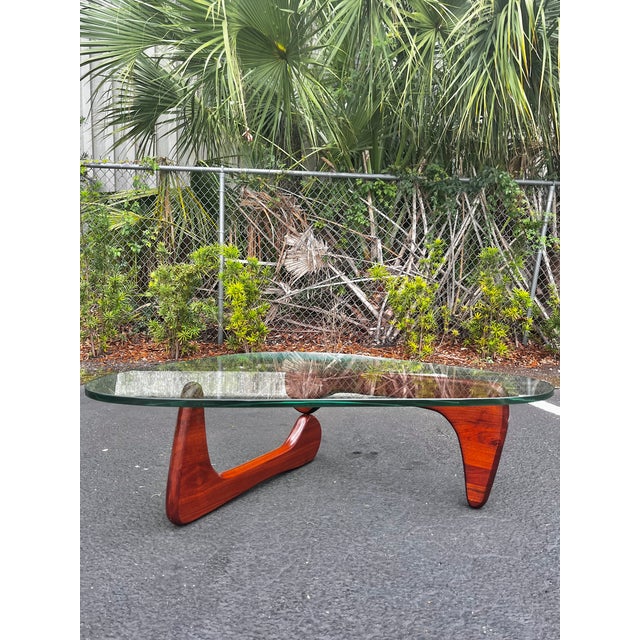 Mid-century modern Noguchi coffee table. A classic staple of design, this table is a favorite! Thick plate glass top set...