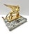 A substantial vintage brass winged lion sculpture mounted on a solid marble base, modeled after the celebrated Lion of...