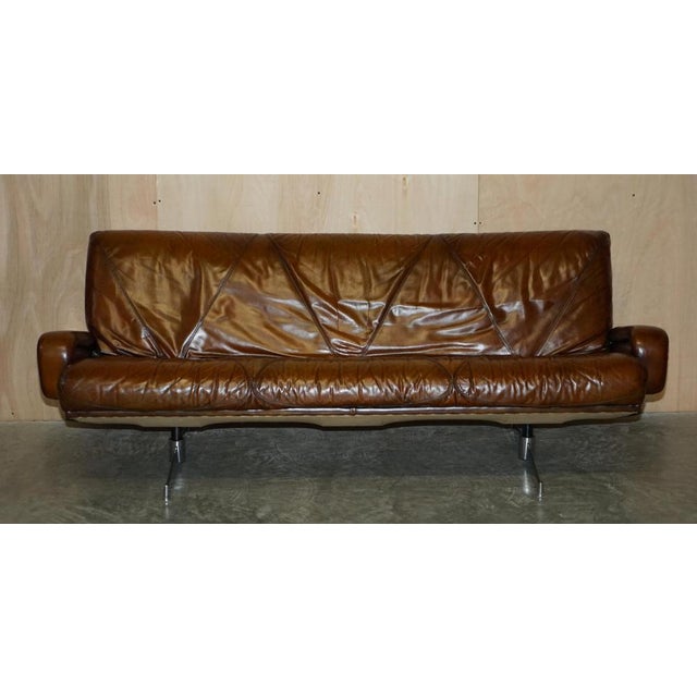 We are delighted to offer for sale this absolutely stunning, hand dyed whisky brown leather, mid century modern sofa which...