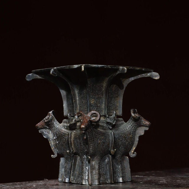 This impressive vintage Chinese vessel is crafted from bronze, modeled after an archaic square Zun (ritual wine vessel)....