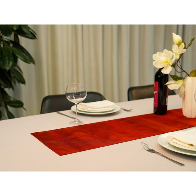 The scarlet horizon. The graduated dye that holds three temperatures of red in one cloth — scarlet, vermilion, and the...