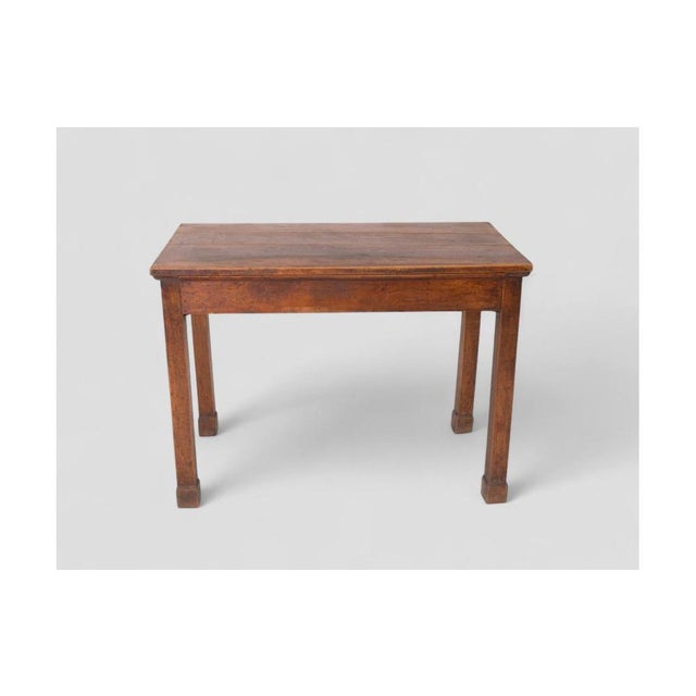 This charming rustic table is a perfect example of simplicity and functionality, crafted entirely from solid wood with an...