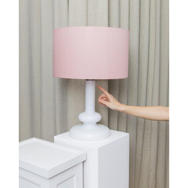 Rare, poorly-blown white glass table lamp, which was designed in the 1970s by the Taiwanese European designer. The lamp...