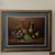 The product is a vintage original still life painting on canvas by artist Parkey, featuring a fruit and wine scene. The...