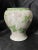 A masterful example of late 19th to early 20th-century Japanese porcelain, this elegant vase features a stunning botanical...