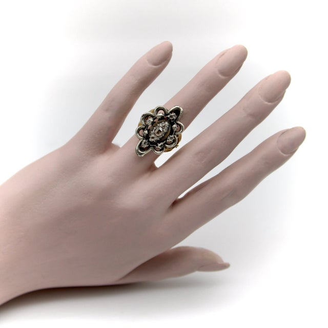 This exquisite ring is a Georgian Revival sterling silver diamond flower top, with a custom made 14 karat yellow gold...