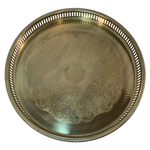 The item is a Mid-Century Modern brass round tray, likely from the mid-20th century. Key features include: Size: 14.5”...