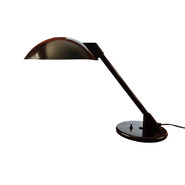Striking 1980's postmodern cantilever desk lamp by Art Specialty Company, featuring an oversized black metal saucer shade,...