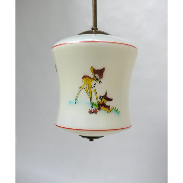 A rare ceiling light by doria, made in the 1950s, featuring three walt disney characters – bambi and thumper. This light...
