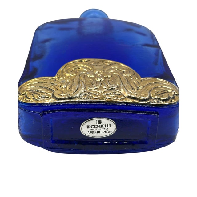Crafted in a distinctive flat-sided, rectangular "hip flask" silhouette, this heavy art glass piece features a deep,...