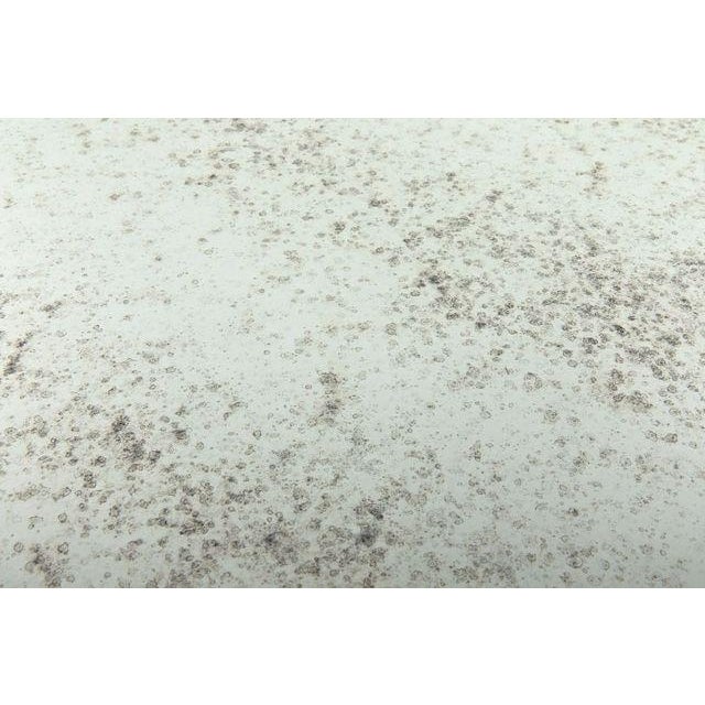 Two rounds of antiqued mirror glass are held aloft by slim bands of metal, elevating the uncomplicated lines of this...