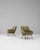 This pair of 1960s French green Art Deco upholstered armchairs features a sculptural silhouette that blends mid-century...