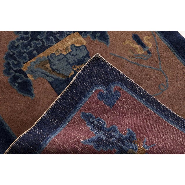 Behold, a magnificent antique rug from the late Ming Dynasty period, a true testament to the artistry and craftsmanship of...