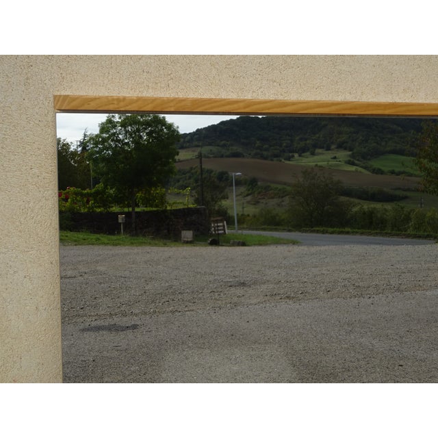 Simple, vertical mirror from the 1970s. Discreet, light oak frame with beveled corners. Compressed wood backing with two...